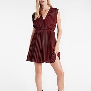 A flowy fit & flare dress with all-over pleating & a flattering v-neck.